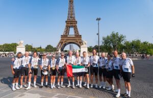 Cycle Against Cancer riders celebrate completing the Barcelona-to-Paris endurance ride.